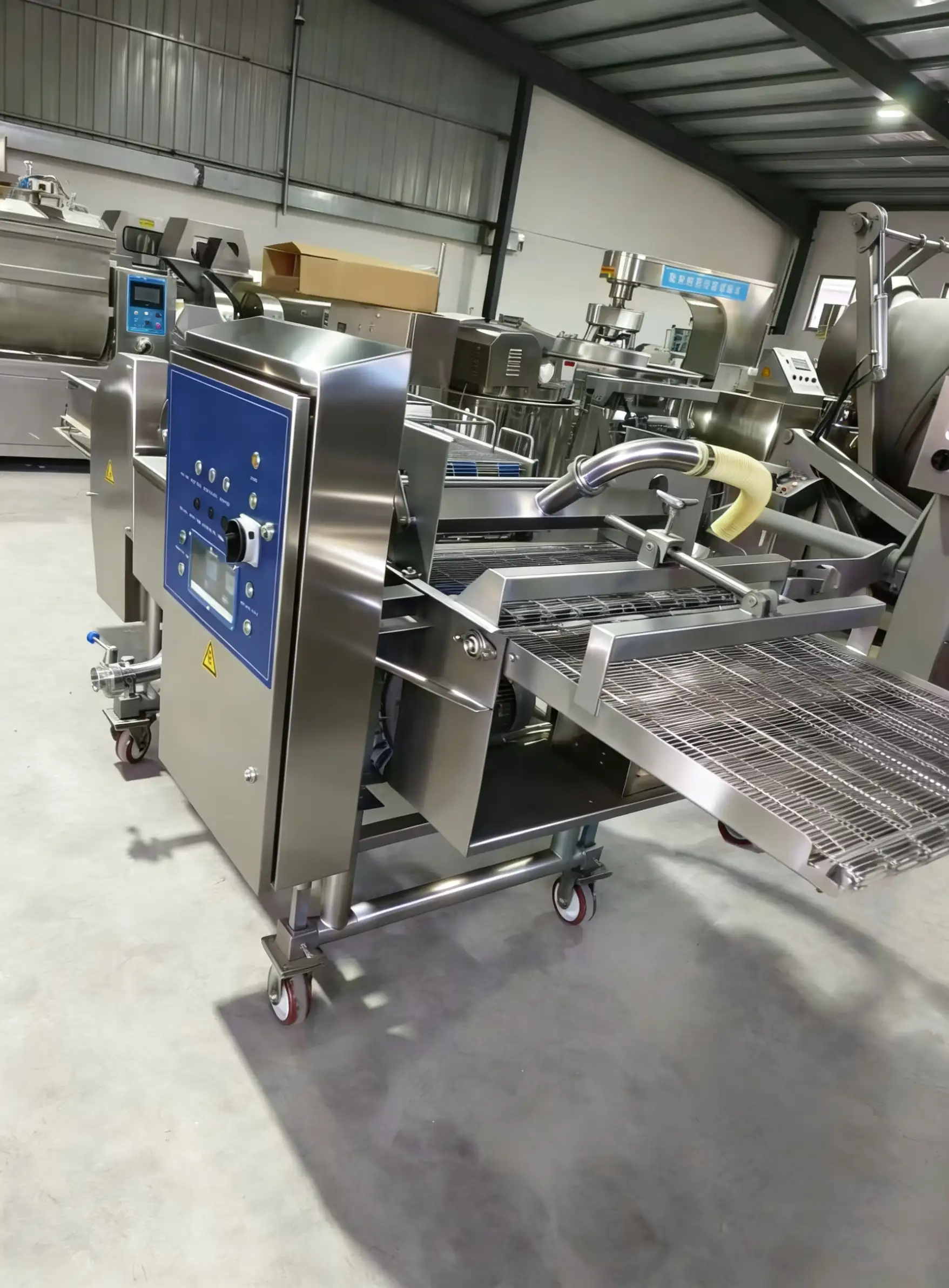 Burger patty predusting and battering line connecting seamlessly with forming and frying machines.