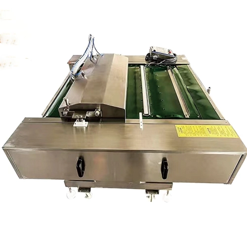 Continuous belt vacuum packaging machine designed for high-volume automated food processing lines.